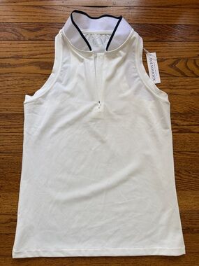 Addison Bay Cream Sleeveless Golf Polo Top with white collar black trim